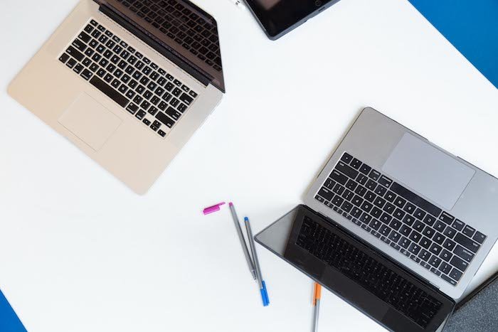 Top view of laptops on a desk